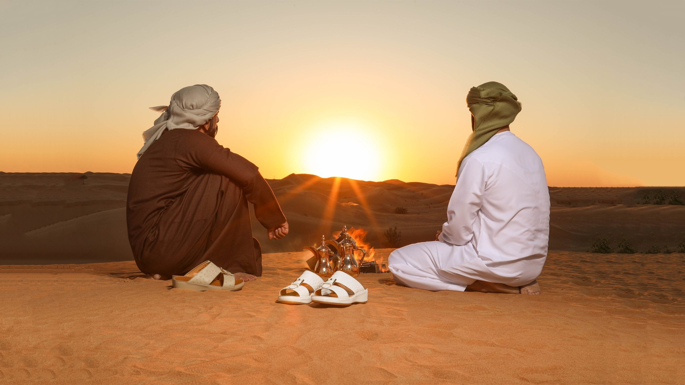 local men sitting in desert