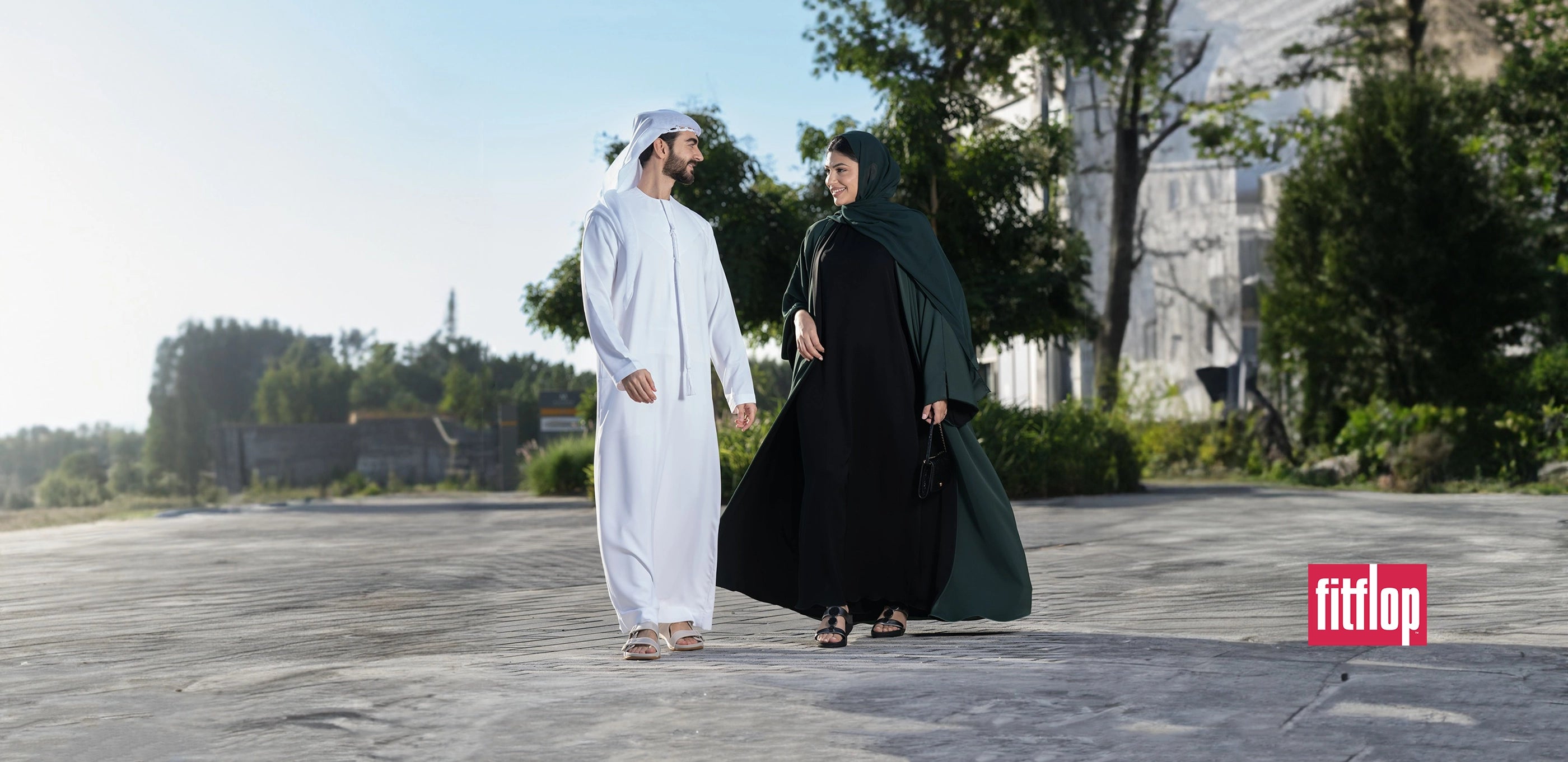 local man and wife walking in fitflop sandals