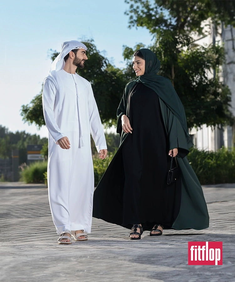 local man and wife walking in fitflop sandals